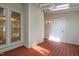 Covered, screened-in porch with wood floors provides an outdoor living space and backyard access at 104 Planetree Ln, Cary, NC 27511