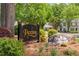 Community sign, surrounded by greenery, marking the entrance to the lovely Paxton neighborhood at 104 Planetree Ln, Cary, NC 27511
