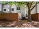A well-maintained townhome featuring a fenced patio with sliding glass door access to the backyard at 104 Sir Richard Ln, Chapel Hill, NC 27517