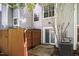 Back patio area featuring a wooden fence for privacy and an sliding glass door for indoor/outdoor living at 104 Sir Richard Ln, Chapel Hill, NC 27517