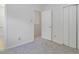 Bright bedroom features carpeted floors, white walls, and closet with double doors at 104 Sir Richard Ln, Chapel Hill, NC 27517