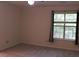 Bright bedroom with neutral carpet, window and paint at 104 Sir Richard Ln, Chapel Hill, NC 27517
