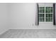 Well-lit bedroom with a large window and neutral-toned carpeting, and dark curtains at 104 Sir Richard Ln, Chapel Hill, NC 27517