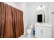 Bathroom with toilet, shower with curtain, and vanity with cabinets at 10530 Sablewood Dr # 112, Raleigh, NC 27617
