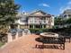 Community patio with brick pavers, gas grills, outdoor seating, and fire pit at 10530 Sablewood Dr # 112, Raleigh, NC 27617