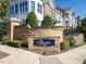 Stone sign for The Cottages at Brier Creek with landscaping at 10530 Sablewood Dr # 112, Raleigh, NC 27617