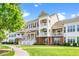 Home exterior featuring a manicured front yard and multiple balconies at 10530 Sablewood Dr # 112, Raleigh, NC 27617