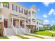 Exterior view of a multi-story home with inviting curb appeal and a well-maintained lawn at 10530 Sablewood Dr # 112, Raleigh, NC 27617