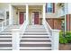 Close up on the front entrances with detailed porch and entry doors at 10530 Sablewood Dr # 112, Raleigh, NC 27617