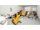 Cluttered garage with rocking chairs, storage, and white walls at 10530 Sablewood Dr # 112, Raleigh, NC 27617