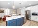 Modern kitchen featuring a large island, stainless appliances, and seamless flow to the living areas at 10530 Sablewood Dr # 112, Raleigh, NC 27617