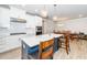 Spacious kitchen with a large island and modern appliances open to the dining room at 10530 Sablewood Dr # 112, Raleigh, NC 27617