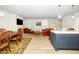 Bright living area flows into a dining area with an open-concept kitchen and elegant finishes at 10530 Sablewood Dr # 112, Raleigh, NC 27617