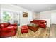Stylish living room with comfortable leather furniture and access to the outdoor balcony at 10530 Sablewood Dr # 112, Raleigh, NC 27617