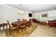 Inviting open-concept living and dining area with a fireplace and access to the balcony at 10530 Sablewood Dr # 112, Raleigh, NC 27617