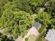 Aerial view of home in a heavily wooded area with a fire pit in the back at 107 Forest Rd, Oxford, NC 27565