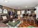 Spacious basement with a rustic wood bar, sports memorabilia, and entertainment area, perfect for gatherings at 107 Forest Rd, Oxford, NC 27565