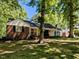 Beautiful home featuring a brick facade and a inviting covered front porch at 107 Forest Rd, Oxford, NC 27565