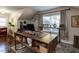 Stylish home office with a large desk, hardwood floors, and natural light from the window at 107 Forest Rd, Oxford, NC 27565