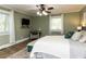 Comfortable primary bedroom with a ceiling fan, windows, and neutral decor at 107 Forest Rd, Oxford, NC 27565