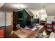 Spacious home office featuring a custom desk, built-in shelves, and modern décor at 107 Forest Rd, Oxford, NC 27565