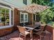 Charming brick patio with a dining area, perfect for outdoor entertaining at 107 Forest Rd, Oxford, NC 27565