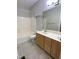 Bathroom with double vanity, bathtub and shower combo, and tile floors at 113 Conner Dr # 103, Chapel Hill, NC 27514