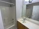 A clean bathroom features a vanity, mirror, and a shower-tub combo at 113 Conner Dr # 103, Chapel Hill, NC 27514