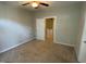 Neutral bedroom featuring carpet and light paint, with a doorway to the hallway at 113 Conner Dr # 103, Chapel Hill, NC 27514