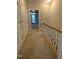 Carpeted hallway with access to rooms; note the neutral color scheme at 113 Conner Dr # 103, Chapel Hill, NC 27514