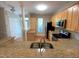 Open kitchen with granite countertops, stainless appliances and light wood cabinetry at 113 Conner Dr # 103, Chapel Hill, NC 27514
