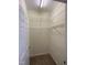 Walk-in closet with installed wire shelving and carpet flooring at 113 Conner Dr # 103, Chapel Hill, NC 27514