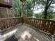 Charming wooden balcony with views of lush greenery, perfect for relaxing and enjoying the outdoors at 113 Conner Dv # 106, Chapel Hill, NC 27514