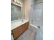 Bathroom featuring a vanity with ample storage, a large mirror, and a shower-tub combination at 113 Conner Dv # 106, Chapel Hill, NC 27514