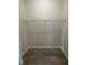 Compact storage area equipped with shelving and a dedicated space for a washer and dryer at 113 Conner Dv # 106, Chapel Hill, NC 27514