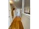 Inviting entryway with hardwood floors and staircase leading to upper level, complemented by natural light streaming in at 113 Conner Dv # 106, Chapel Hill, NC 27514