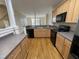Well-equipped kitchen with modern appliances, light wood cabinetry, and countertop, providing ample storage and prep space at 113 Conner Dv # 106, Chapel Hill, NC 27514