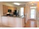 Bright kitchen featuring light wood cabinets, stainless steel appliances, and an open layout perfect for entertaining at 113 Conner Dv # 106, Chapel Hill, NC 27514