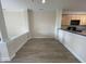 Open-concept living room with light wood floors and neutral walls, creating a versatile and inviting space at 113 Conner Dv # 106, Chapel Hill, NC 27514