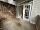 Private porch with wood flooring and a partial fence, perfect for outdoor relaxation at 113 Conner Dv # 106, Chapel Hill, NC 27514