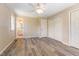 Comfortable bedroom with hardwood floors, a ceiling fan, and an ensuite bathroom at 1303 Cherry Dr, Burlington, NC 27215
