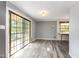 Bright, airy room with a sliding glass door and wood-look floors, perfect for dining or relaxing at 1303 Cherry Dr, Burlington, NC 27215