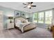 Bright bedroom with multiple windows, a ceiling fan, and a comfortable upholstered bed at 137 Cultivator Ct, Angier, NC 27501