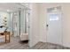 Inviting foyer with a white front door and sidelight, leading to a bright, airy living space at 137 Cultivator Ct, Angier, NC 27501