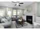 Spacious living room featuring a fireplace, neutral decor, and a view of the outdoors at 137 Cultivator Ct, Angier, NC 27501