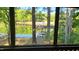 Scenic backyard view showcasing waterfront access, a private dock, and a covered boat slip at 1605 Sagamore Dr, Louisburg, NC 27549