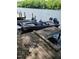 Docked Pro 165 boat with dark green hull and seats for fishing at 1605 Sagamore Dr, Louisburg, NC 27549
