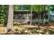 Quaint lake house with a screened porch offers a serene escape amidst nature at 1605 Sagamore Dr, Louisburg, NC 27549