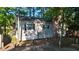 Charming home nestled amongst mature trees with steps leading down to the lake at 1605 Sagamore Dr, Louisburg, NC 27549