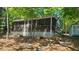 Charming lake house with a screened porch, providing a relaxing outdoor space at 1605 Sagamore Dr, Louisburg, NC 27549